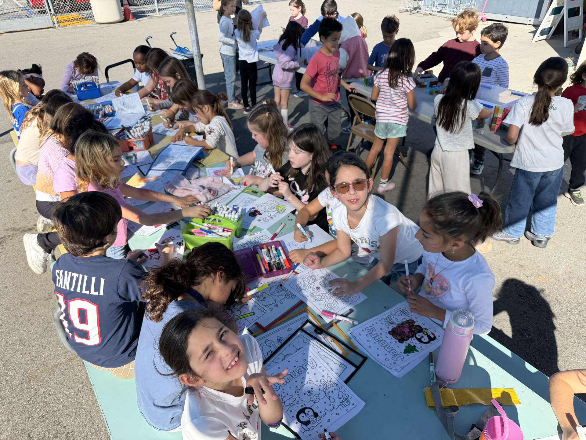 Kids at a table doing lunchtime activities